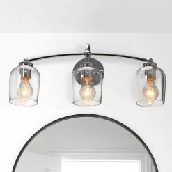 Adrian - 23 in. 3-Light Steel Chrome Finish and Clear Glass Vanity Light by Robert Stevenson Lighting -Litton Lane Sales chrome robert stevenson lighting vanity lighting ec1167c 31 1000