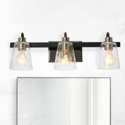 Jameson - 22 in. 3-Light Matte Black and Polished Nickel Vanity Light Metal Seedy Glass by Robert Stevenson Lighting -Litton Lane Sales matte black polished nickel robert stevenson lighting vanity lighting ec1174c 31 1000